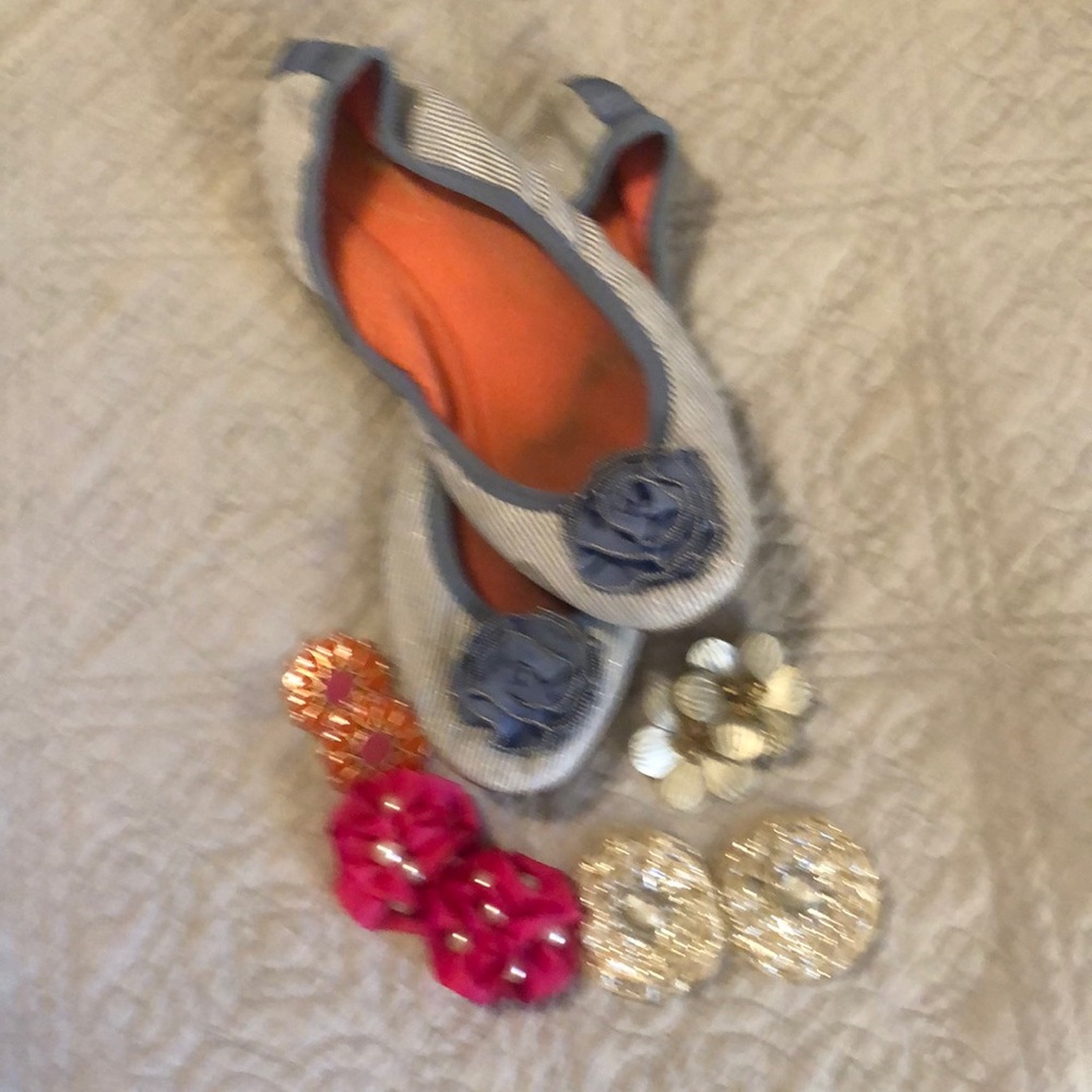 Flat pull on shoes with multiple change out accessories.